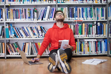 Image showing the students uses a notebook, laptop and a school library