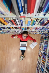 Image showing the students uses a notebook, laptop and a school library