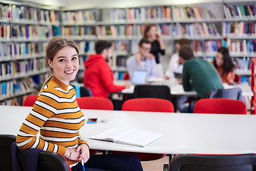 Image showing student taking notes for school class