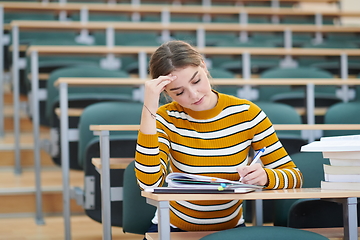 Image showing student taking notes for school class