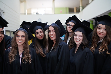 Image showing Group of diverse international graduating students celebrating