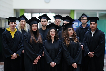 Image showing Group of diverse international graduating students celebrating