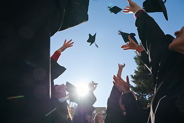 Image showing Group of diverse international graduating students celebrating