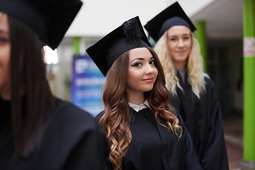 Image showing Group of diverse international graduating students celebrating