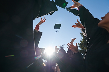 Image showing Group of diverse international graduating students celebrating