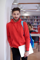 Image showing the student uses a laptop and a school library