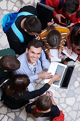 Image showing students using modern technology for school project