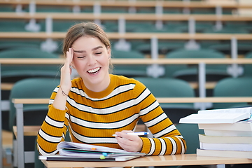 Image showing student taking notes for school class