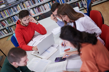 Image showing students group working on school project together on tablet computer at modern university