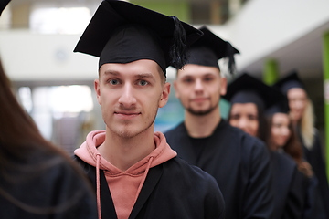 Image showing Group of diverse international graduating students celebrating