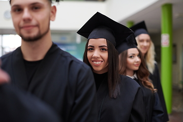 Image showing Group of diverse international graduating students celebrating