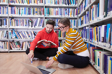 Image showing the students uses a notebook, laptop and a school library