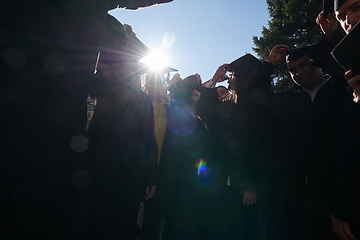 Image showing Group of diverse international graduating students celebrating