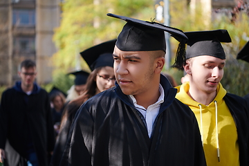 Image showing Group of diverse international graduating students celebrating