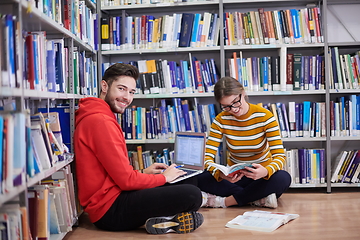 Image showing the students uses a notebook, laptop and a school library