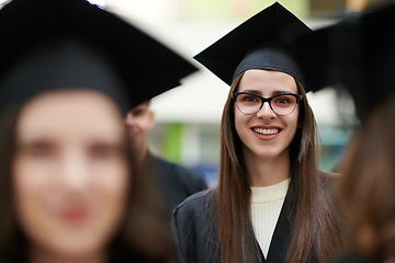 Image showing Group of diverse international graduating students celebrating