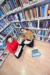 Image showing the students uses a notebook, laptop and a school library