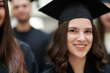 Image showing Group of diverse international graduating students celebrating