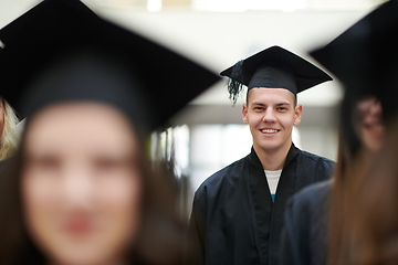 Image showing Group of diverse international graduating students celebrating