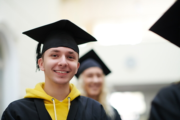 Image showing Group of diverse international graduating students celebrating