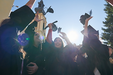 Image showing Group of diverse international graduating students celebrating