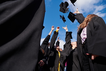 Image showing Group of diverse international graduating students celebrating