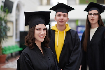 Image showing Group of diverse international graduating students celebrating