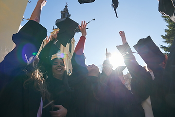 Image showing Group of diverse international graduating students celebrating