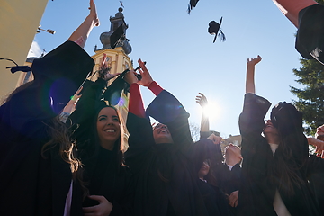 Image showing Group of diverse international graduating students celebrating