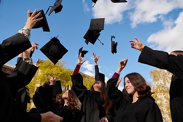 Image showing Group of diverse international graduating students celebrating