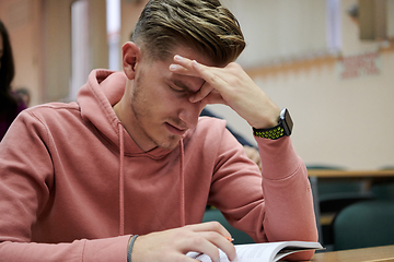 Image showing the student has a headache in class