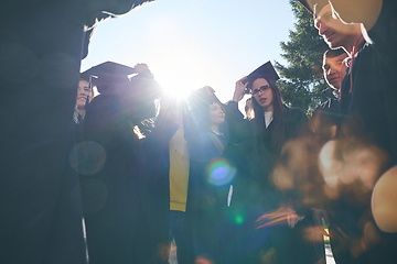 Image showing Group of diverse international graduating students celebrating