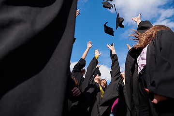 Image showing Group of diverse international graduating students celebrating