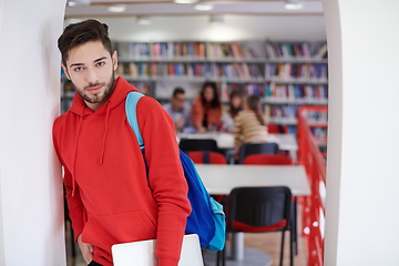 Image showing the student uses a laptop and a school library