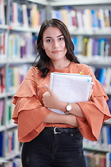 Image showing the student uses a notebook and a school library