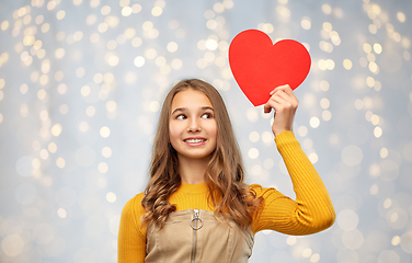 Image showing smiling teenage girl with red heart