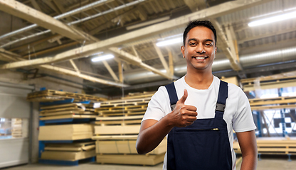 Image showing happy indian worker showing thumbs up at warehouse