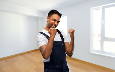 Image showing indian builder celebrating success at new home