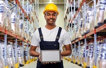 Image showing happy indian worker with tablet pc at warehouse