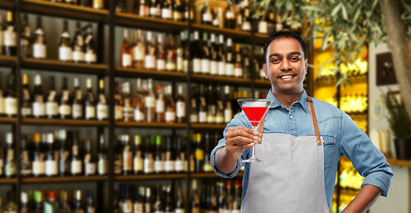 Image showing indian barman with glass of cocktail at bar