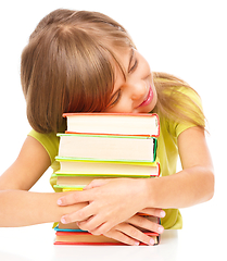 Image showing Little girl with her books