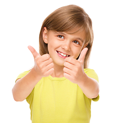 Image showing Little girl is showing thumb up sign