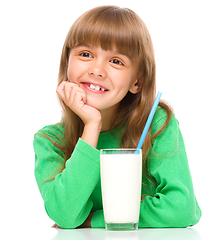 Image showing Cute little girl with a glass of milk