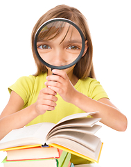 Image showing Little girl is reading book