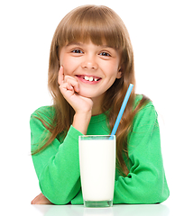 Image showing Cute little girl with a glass of milk