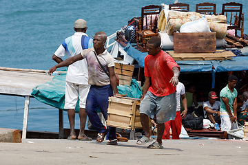 Image showing Malagasy peoples loading ship in Nosy Be, Madagascar