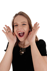 Image showing Young lovely woman screaming 