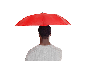 Image showing Black man standing from back with red umbrella