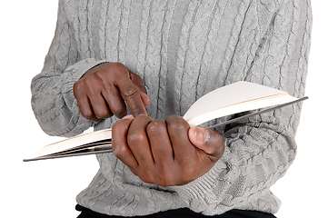 Image showing Closeup image of black man holding a book