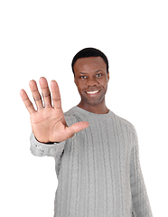 Image showing Smiling black man says stop right now